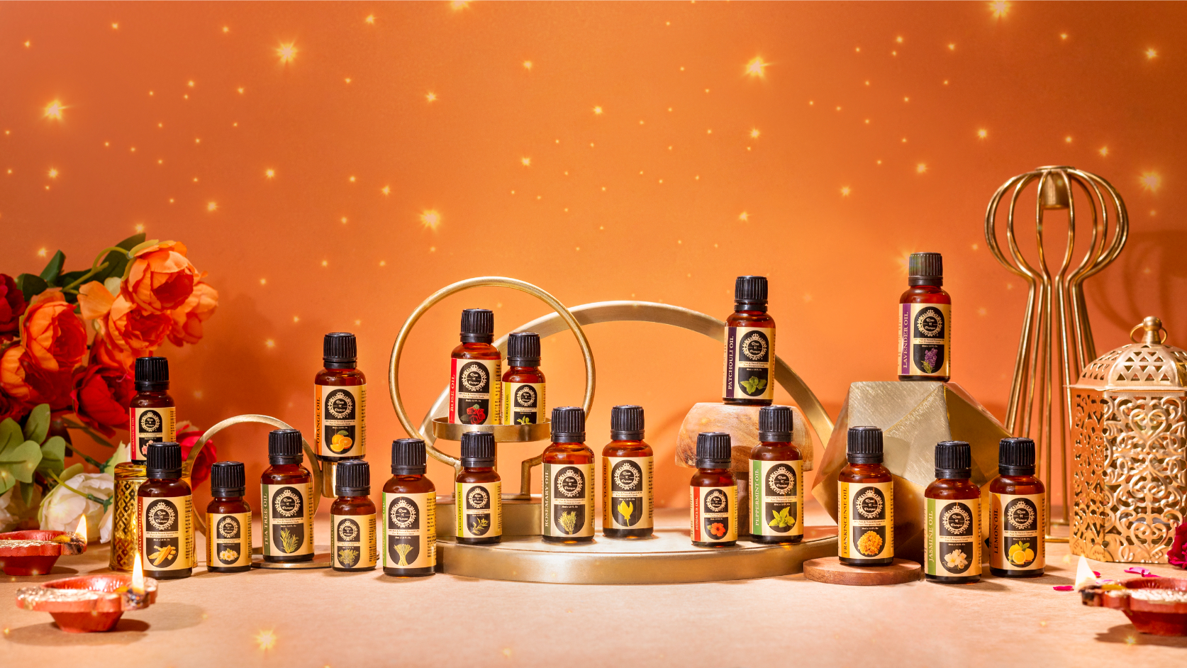 Various bottles of essential oils arranged on a display with a warm background.