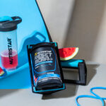 Nutristar Reset BCAA supplement package with a shaker and workout accessories on a blue background.